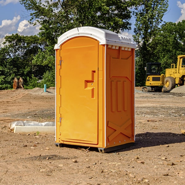 how often are the portable restrooms cleaned and serviced during a rental period in Lackey